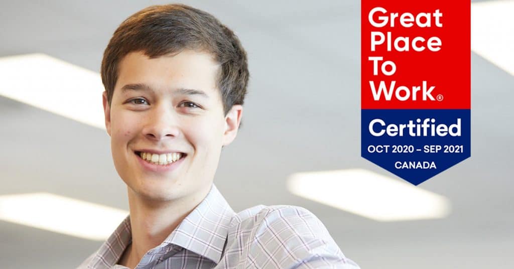 Derwyn Henderson at the Vista Projects office with GPTW logo