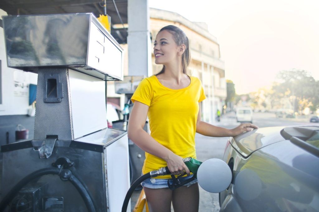 woman pumping biodiesel at the fuel station