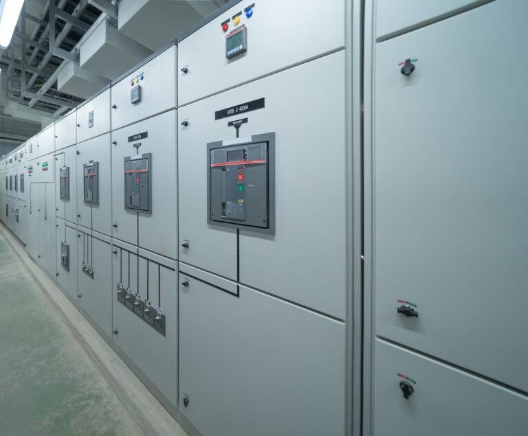 Industrial switchgear cabinets in a manufacturing plant, designed for high-capacity electrical power distribution and safety.