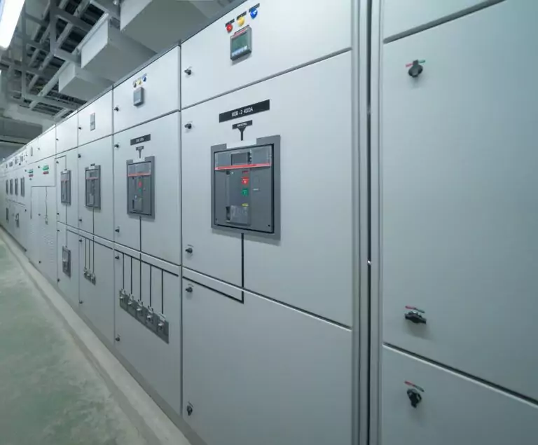 Industrial switchgear cabinets in a manufacturing plant, designed for high-capacity electrical power distribution and safety.