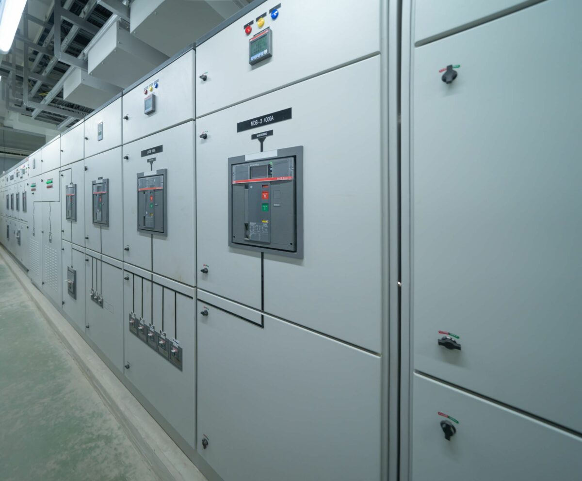 Industrial switchgear cabinets in a manufacturing plant, designed for high-capacity electrical power distribution and safety.