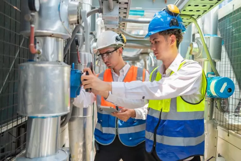 Engineers inspecting industrial sensors and equipment to ensure accuracy, safety, and control system reliability