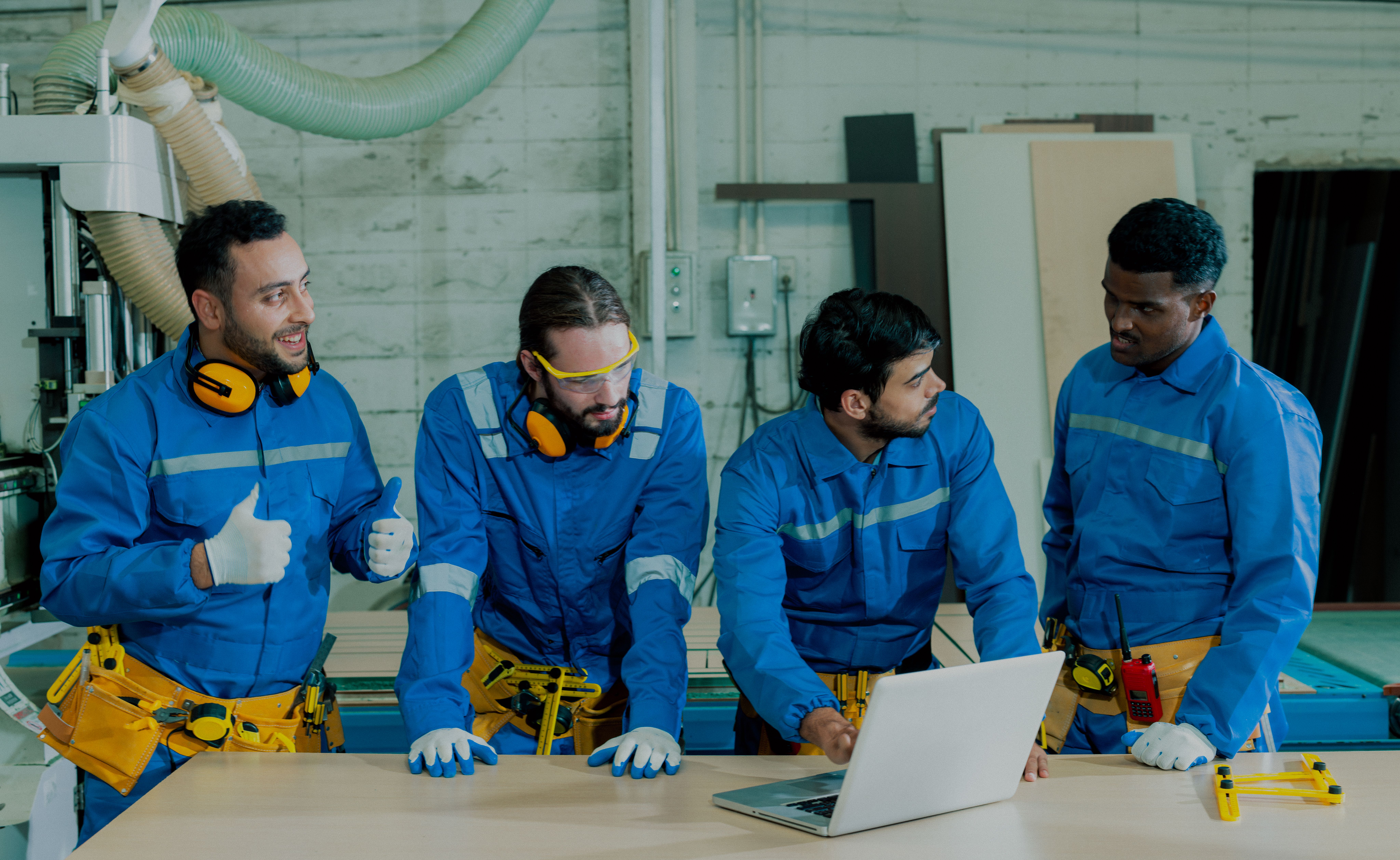 Maintenance team reviewing field repair safety checklist and job plan before industrial equipment servicing